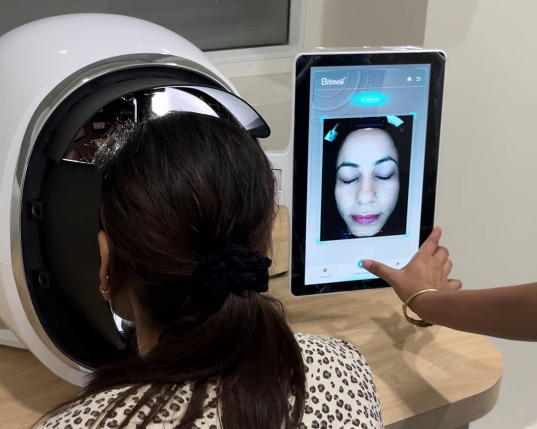 A client using the Visagé Skin Pro+ analyser at Derma Clinic Group
